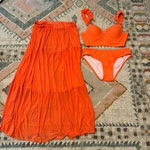 Orange two piece bathing suit and matching skirt